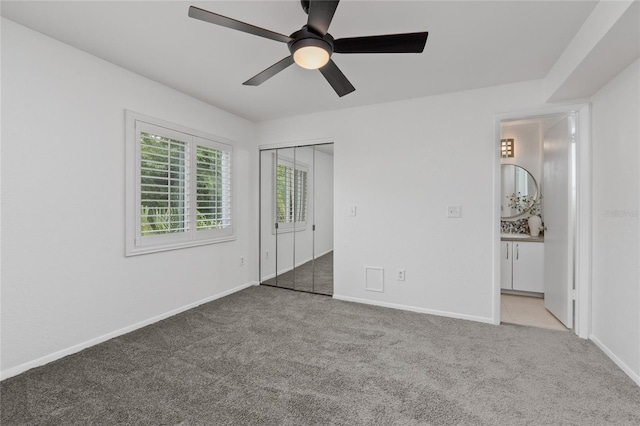 3101 W El Prado Blvd Unit B, Tampa, FL 33629 - unfurnished bedroom with carpet flooring, baseboards, a closet, and a ceiling fan