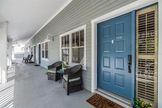 entrance to property featuring covered porch