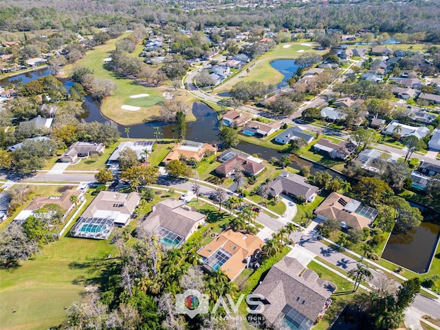 aerial view featuring a water view, a residential view, and golf course view