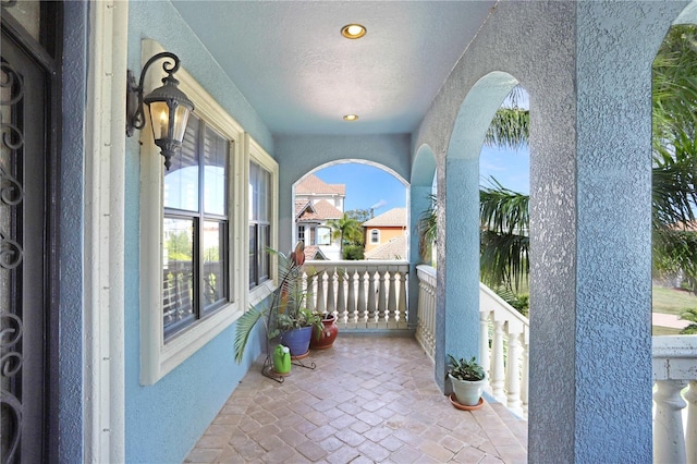 view of patio featuring a balcony