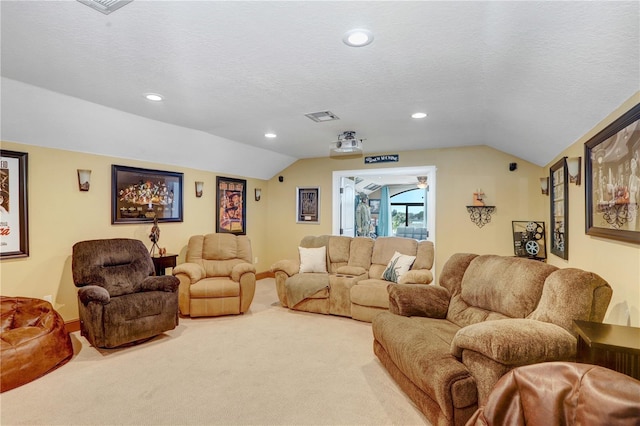 carpeted living area featuring lofted ceiling, visible vents, a textured ceiling, and recessed lighting