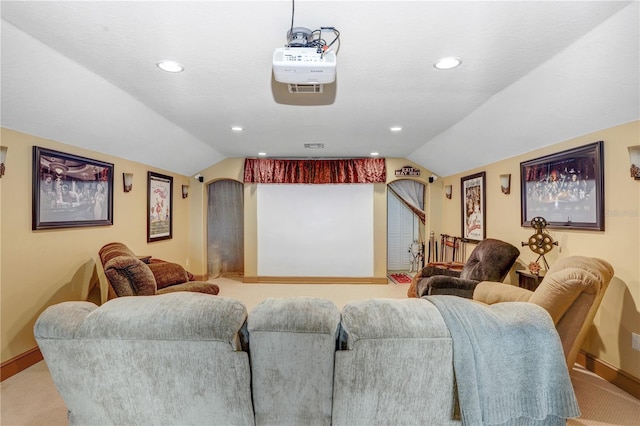 carpeted home theater room featuring visible vents, baseboards, vaulted ceiling, and recessed lighting