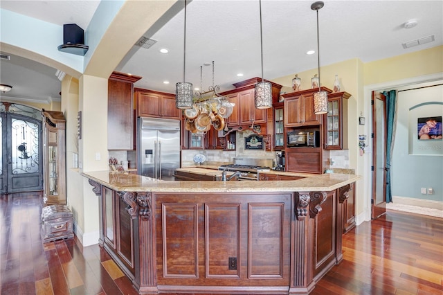 kitchen with arched walkways, stainless steel appliances, tasteful backsplash, visible vents, and glass insert cabinets