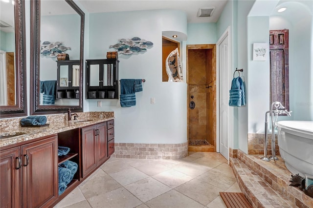 bathroom featuring a soaking tub, visible vents, vanity, tiled shower, and tile patterned floors