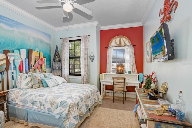 bedroom featuring a textured ceiling, carpet floors, ornamental molding, and ceiling fan