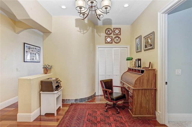 home office with recessed lighting, an inviting chandelier, wood finished floors, and baseboards