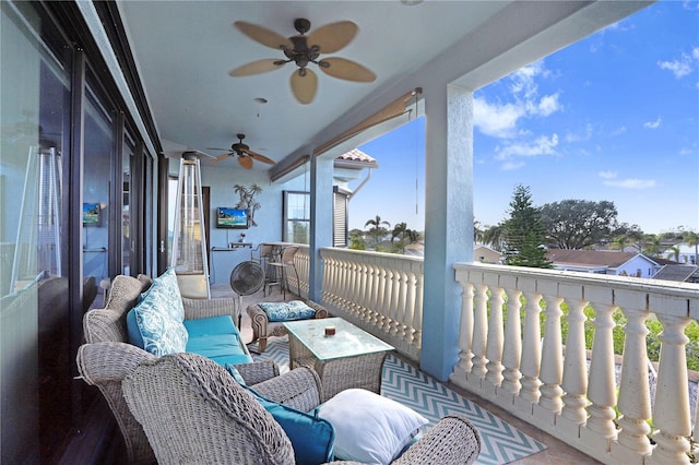 balcony featuring a ceiling fan