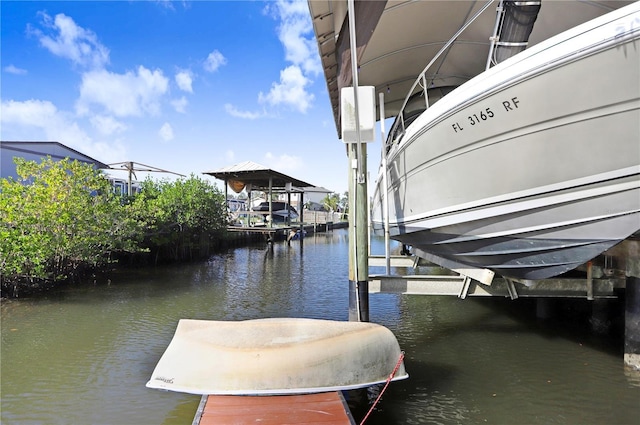 view of dock with a water view and boat lift