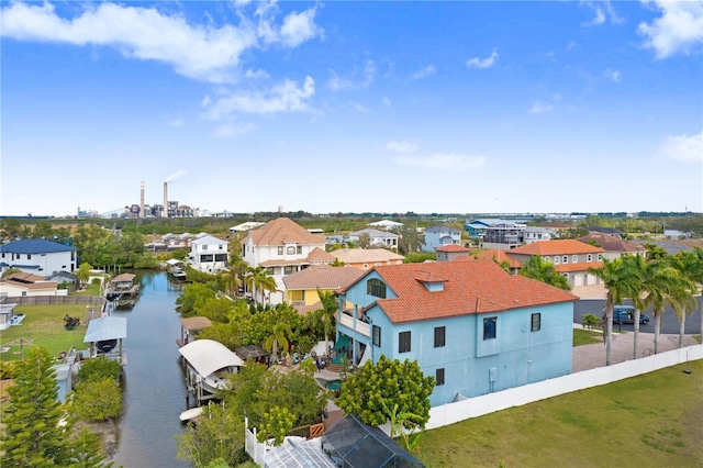 bird's eye view featuring a water view and a residential view