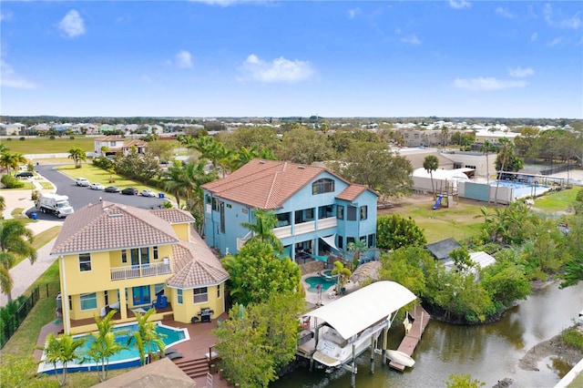 birds eye view of property featuring a water view