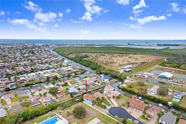 aerial view featuring a water view and a residential view