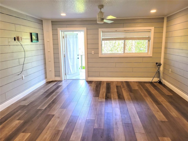 entrance foyer with a textured ceiling, recessed lighting, dark wood-type flooring, a ceiling fan, and baseboards