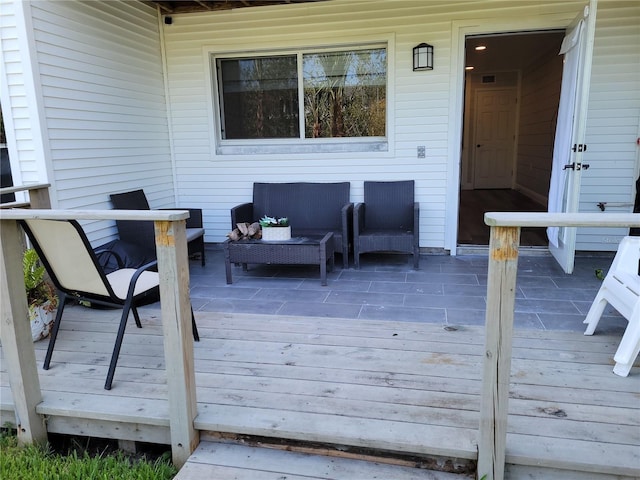 wooden deck featuring an outdoor living space