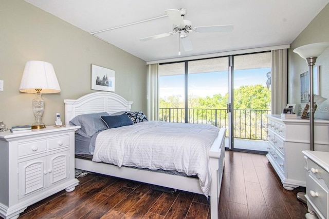 bedroom with access to exterior, a ceiling fan, floor to ceiling windows, and dark wood-style flooring