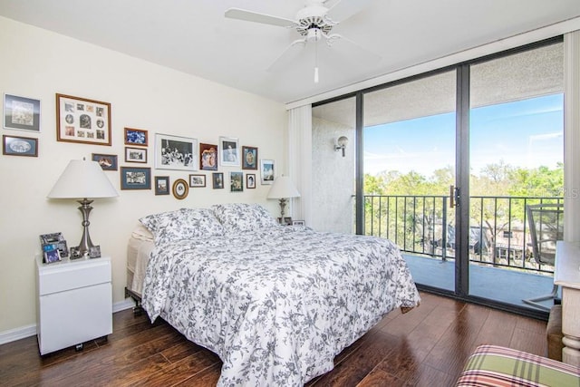 bedroom with dark wood finished floors, a ceiling fan, expansive windows, access to outside, and baseboards