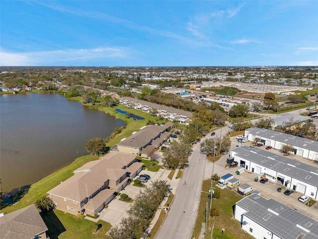 birds eye view of property featuring a water view and a residential view