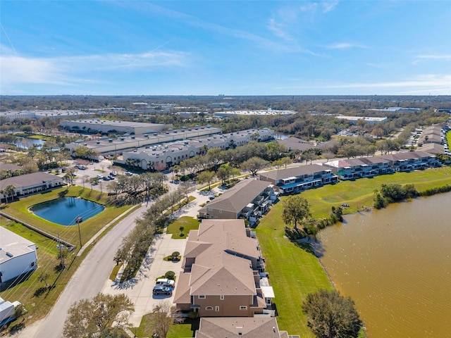 drone / aerial view featuring a water view and a residential view