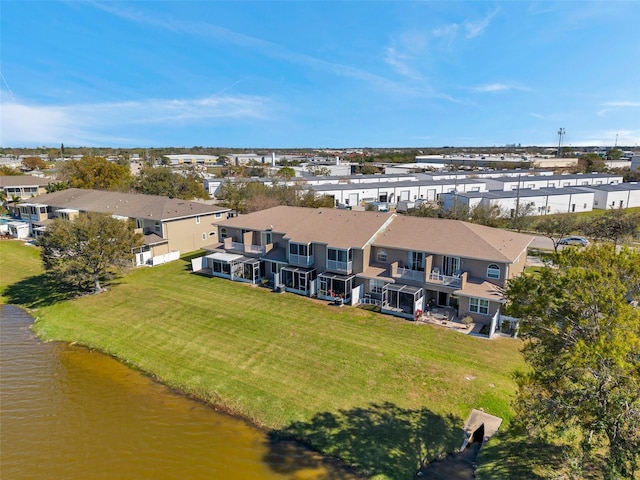 birds eye view of property with a water view and a residential view