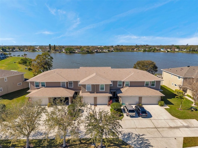 bird's eye view with a water view and a residential view