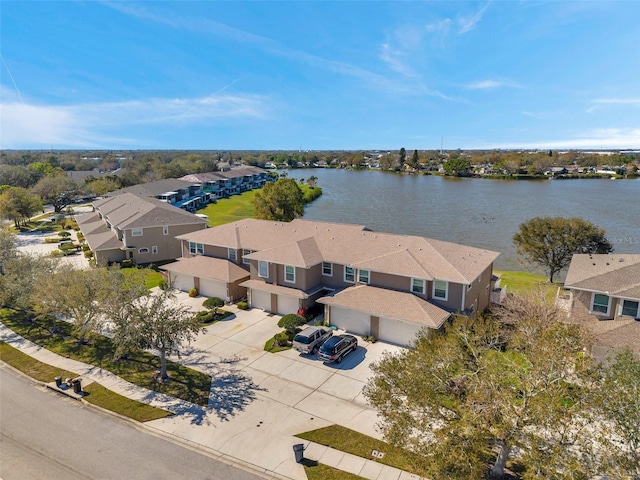 aerial view with a residential view and a water view