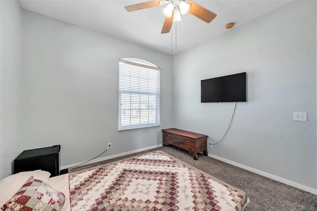 carpeted bedroom featuring ceiling fan and baseboards