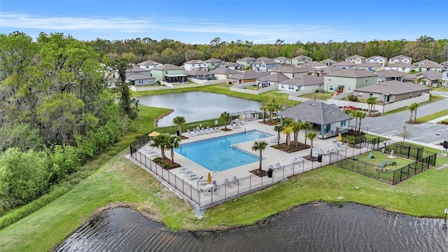 aerial view with a water view and a residential view