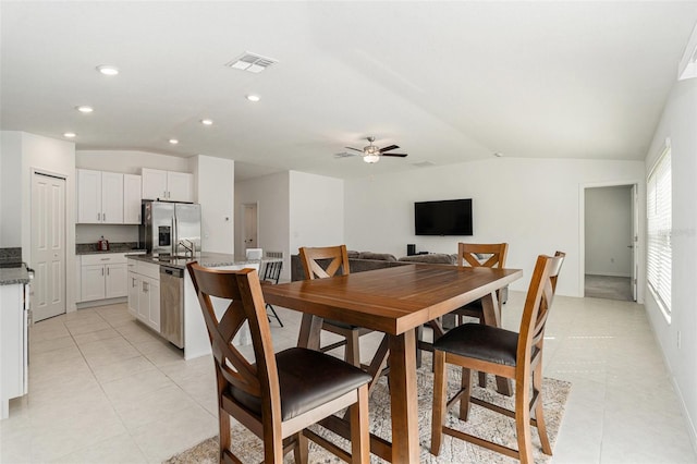 dining space featuring lofted ceiling, light tile patterned flooring, visible vents, and recessed lighting