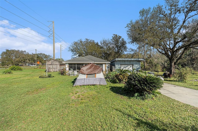 view of yard with a shed and an outdoor structure