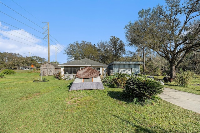 exterior space featuring an outbuilding, a sunroom, and a shed