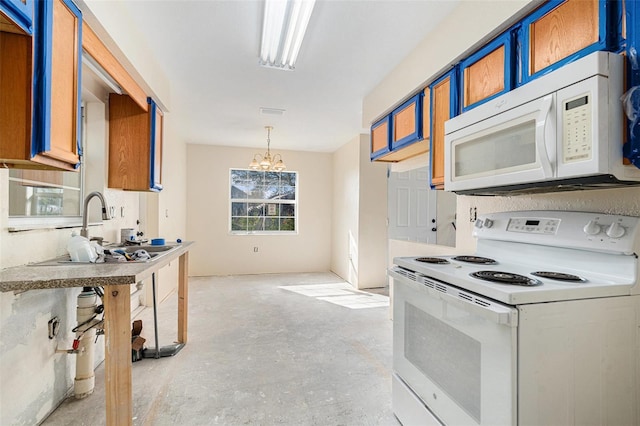 kitchen featuring white appliances, a sink, hanging light fixtures, unfinished concrete flooring, and an inviting chandelier