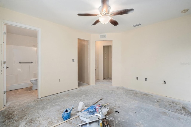 unfurnished bedroom featuring ensuite bath, visible vents, and a ceiling fan