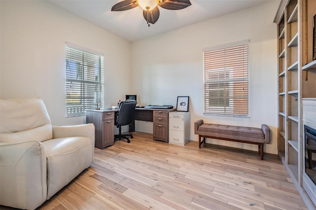 office featuring light wood finished floors and a ceiling fan