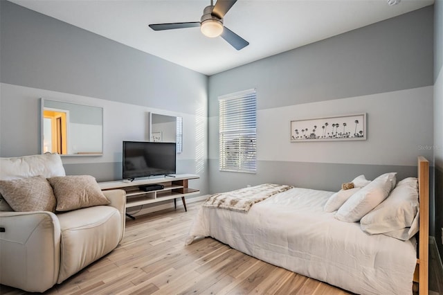 bedroom with a ceiling fan and wood finished floors