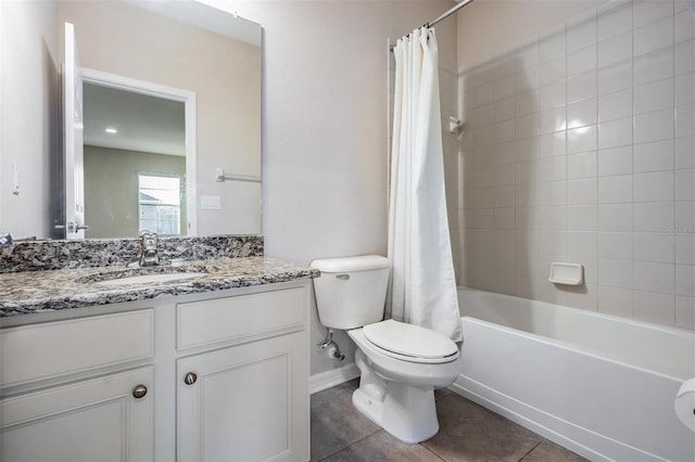 bathroom with toilet, shower / bath combo with shower curtain, vanity, baseboards, and tile patterned floors