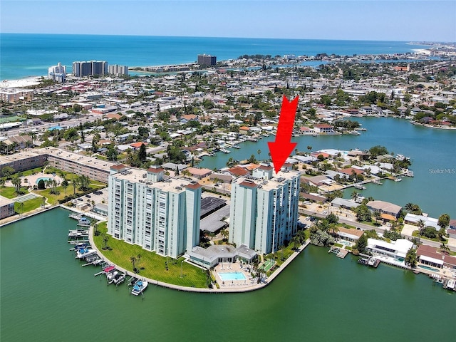 birds eye view of property with a water view