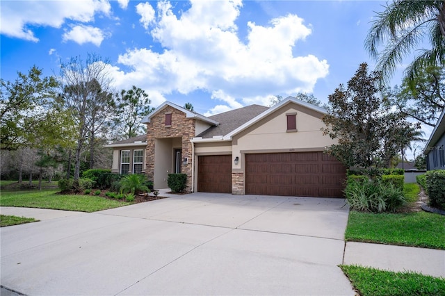 view of front facade with a garage, stone siding, concrete driveway, and stucco siding