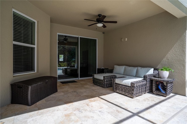 view of patio / terrace featuring ceiling fan and an outdoor living space