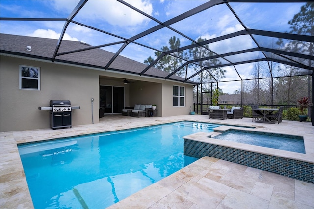 view of pool with a patio, area for grilling, outdoor lounge area, a pool with connected hot tub, and a ceiling fan