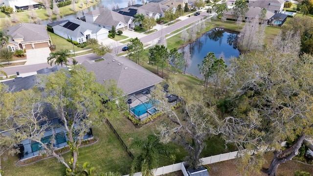 drone / aerial view featuring a residential view and a water view