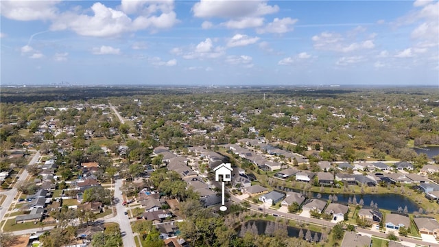 birds eye view of property with a water view and a residential view