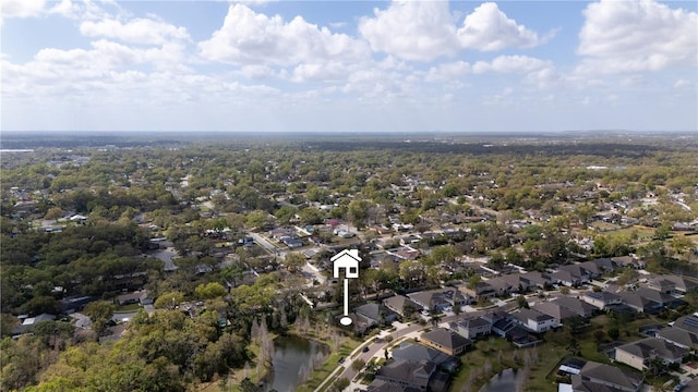 drone / aerial view with a water view and a residential view