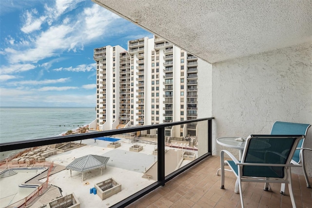 balcony featuring a water view