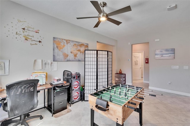 playroom with light tile patterned floors, a ceiling fan, and baseboards