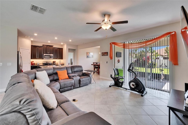 living room featuring visible vents, baseboards, ceiling fan, light tile patterned floors, and recessed lighting