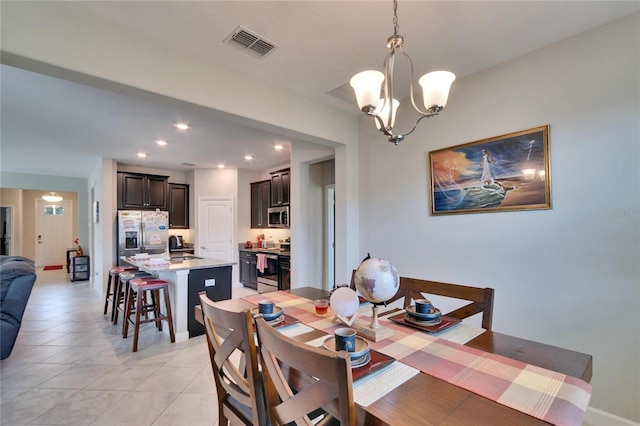 dining space with a notable chandelier, recessed lighting, visible vents, and light tile patterned floors