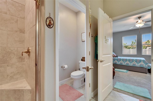 ensuite bathroom with tile patterned floors, toilet, a ceiling fan, ensuite bathroom, and a shower stall