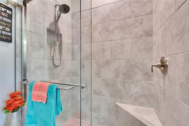 full bath with a shower stall
