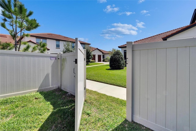 view of yard featuring a gate and fence