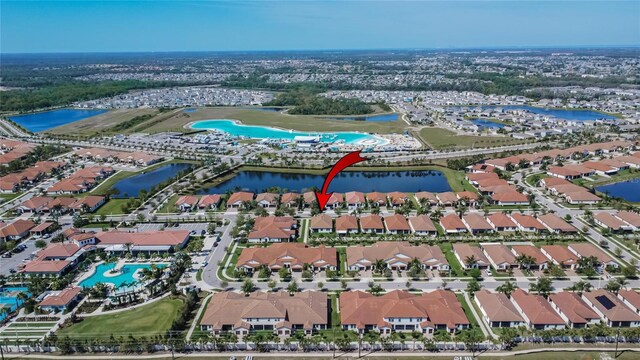 birds eye view of property featuring a residential view and a water view