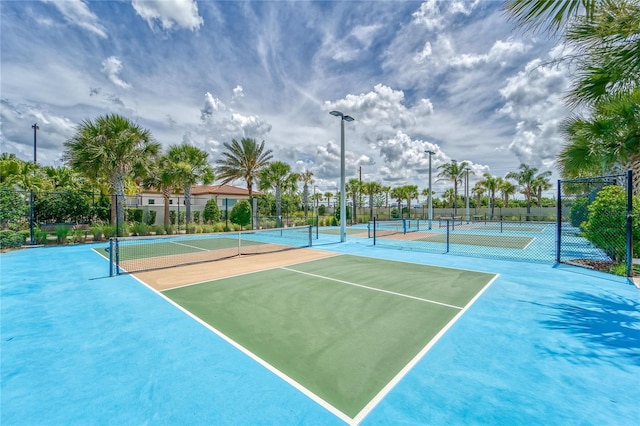 view of sport court featuring community basketball court and fence